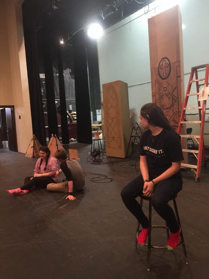 Sophomore, Sophie Waimon, stays in character as Antonio Salierí, listening intently to Mozart, played by senior Dominic Scheerer, and Constanzes, played by Lilah Roth, private conversation in order to sabotage Mozarts career.
