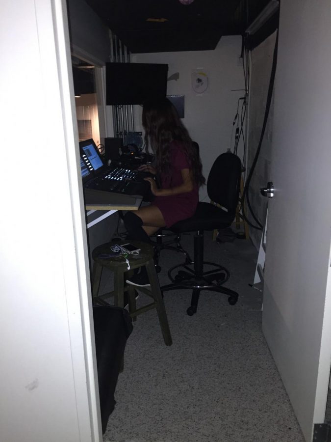 Senior, Isa Blankers, is concentrated as she works upstairs on the lighting aspects of the production.
