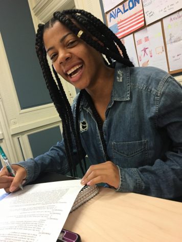 Carrington Newsome, a junior, enjoying AP Lang class in her button down top that happens to be ripped denim!