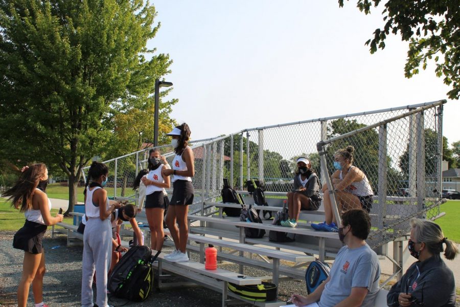 Girls tennis has a practice using social distancing guidelines.