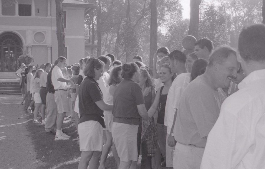 Students, faculty, and staff participate in one of the first All-School-Handshakes.