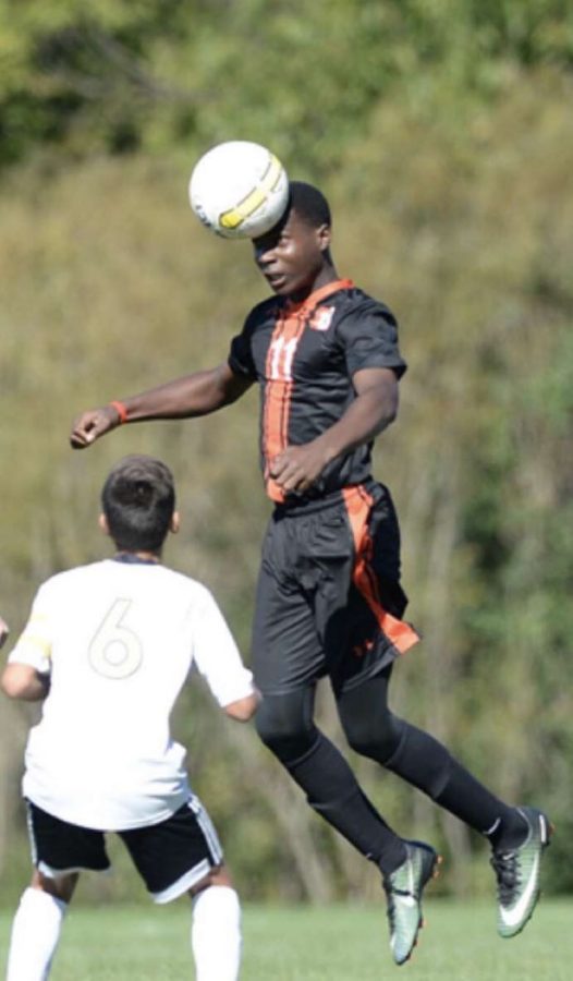 Junior Akindele Aboyade-Cole winning an aerial dual during a soccer game in the fall of 2019, before masks
were a concern