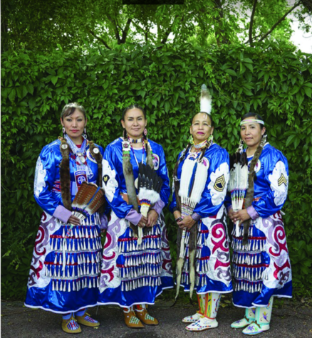 Native American women in traditional garb.