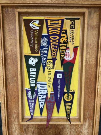 Flags of colleges displayed outside the college counseling office. 
