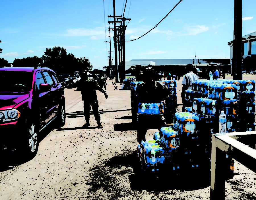 Military personnel distributes bottled water to Jackson citizens 