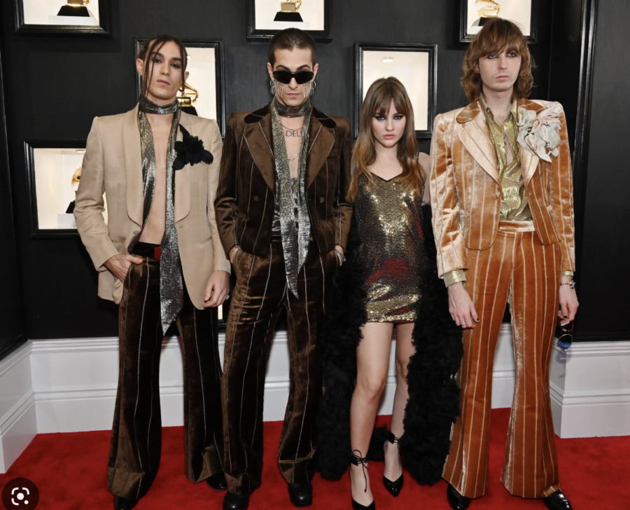 Italian rock band Maneskin poses on the Grammy red carpet.