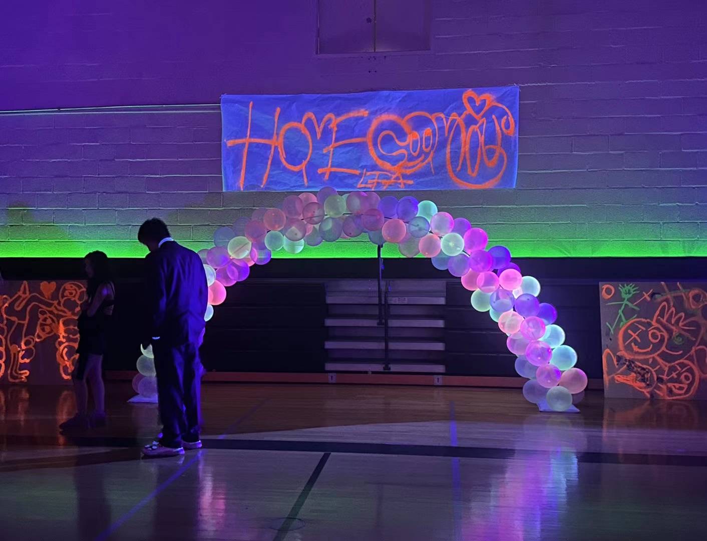 Glow in the dark decorations adorn Homecoming to match the theme.