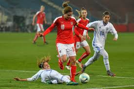 Exiting slide tackle during a match between Austria and Israel.