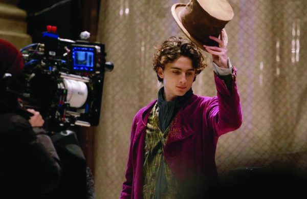 This is a behind-the-scenes photo of Timothee Chalamet in Wonka. 
